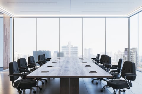 Corporate boardroom with sleek chairs and city view