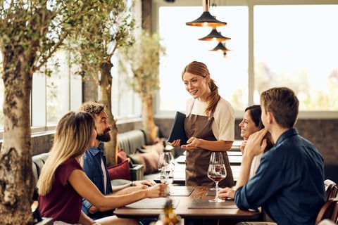 Group of friends enjoying dining in a cozy restaurant