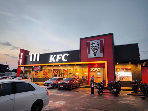 Illuminated KFC restaurant at dusk