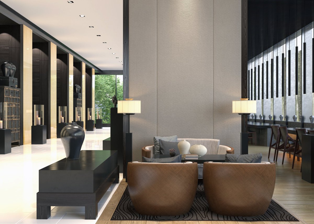 A modern luxury lounge interior featuring a seating area with brown armchairs, a black coffee table, and decorative vases. 3D illustration.